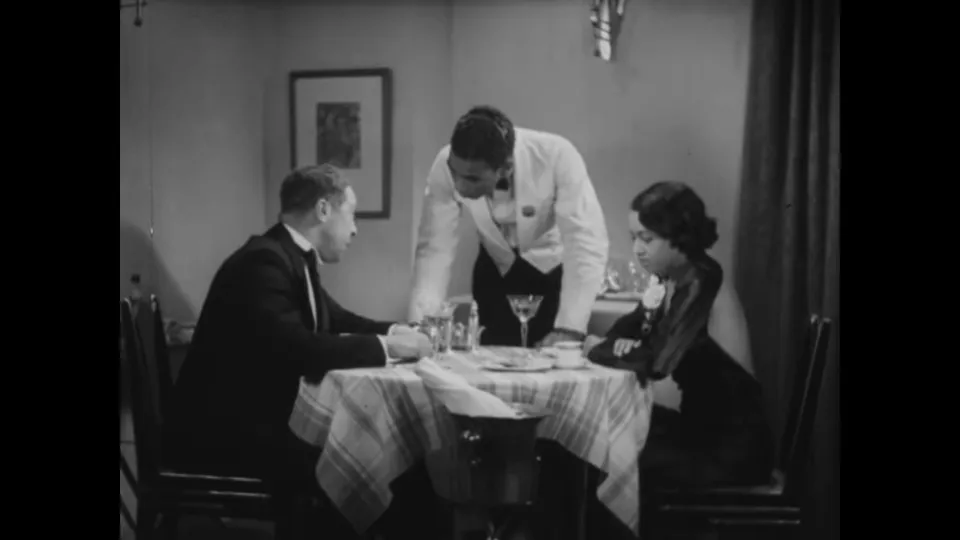 Dinner scene at Club Congo: Flo and Larry share an intimate table