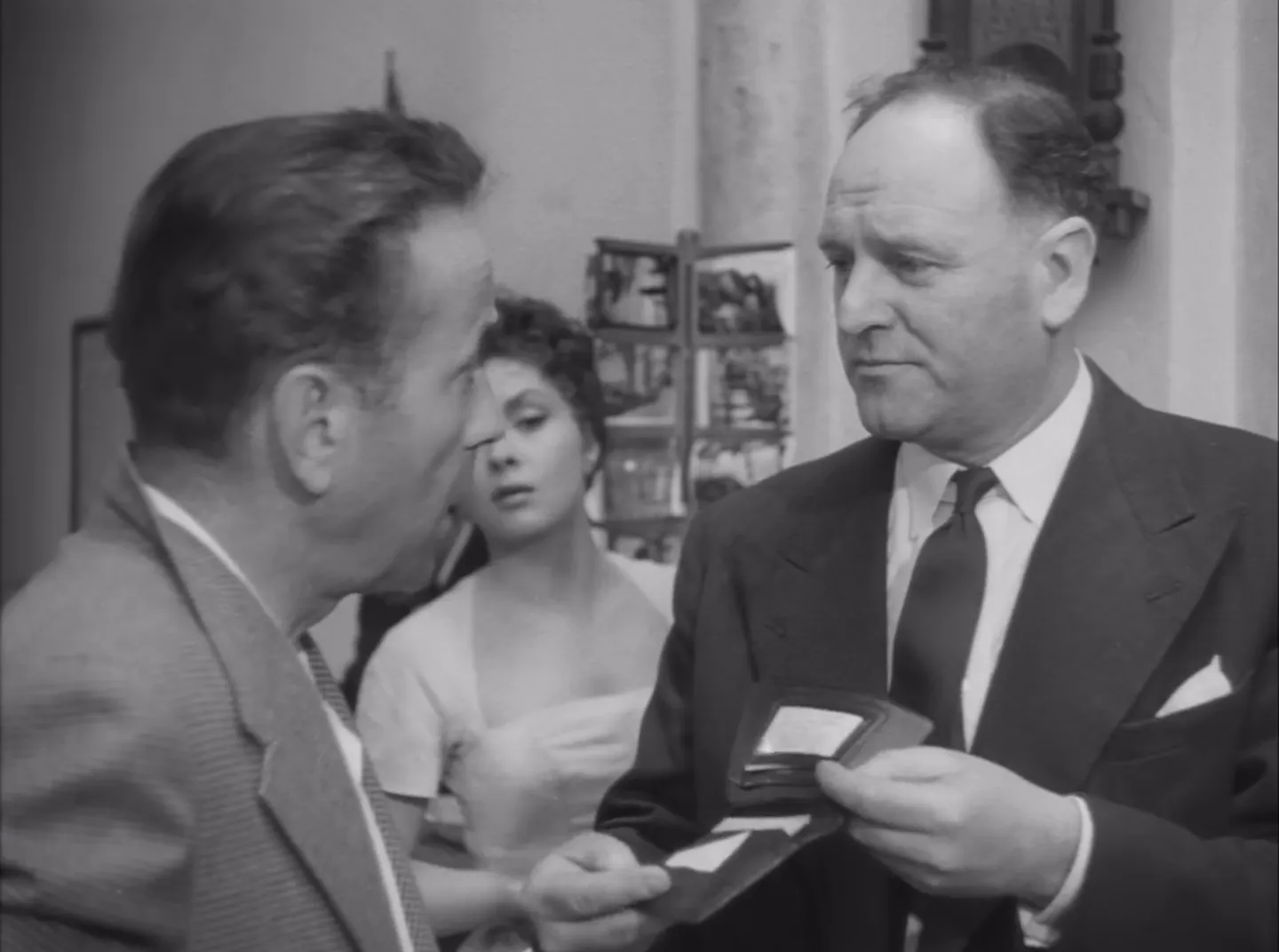 Inspector Jack Clayton arrives; Scotland Yard's intervention signals the law catching up