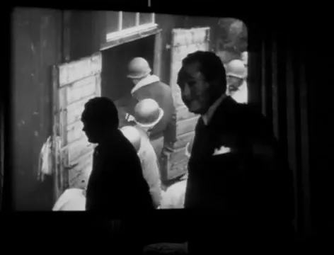 Documentary footage integrated into the narrative—one of the earliest uses of Holocaust imagery in Hollywood.