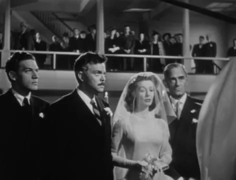 The wedding scene: a public ritual that complicates private truth.