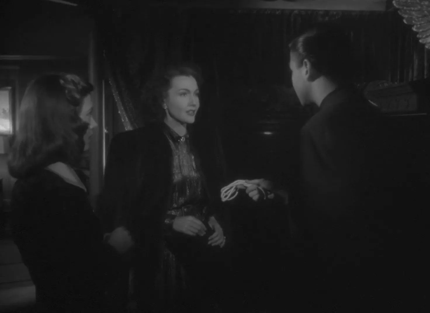The séance begins: darkened room and the key held between hands