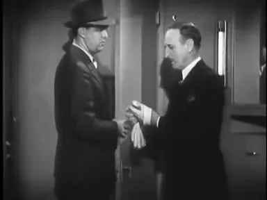 A diamond merchant instructs a conductor, close quarters of a train compartment