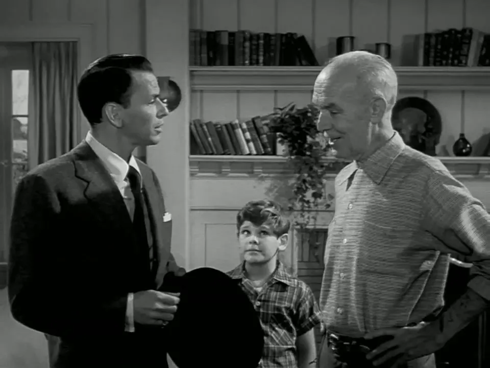 FBI agent Barnes' arrival at the Benson household emphasizes official overtones and sets up the false identity theme