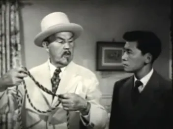 Reenactment sequence: Birmingham simulates the thief at the trunk while Chan instructs