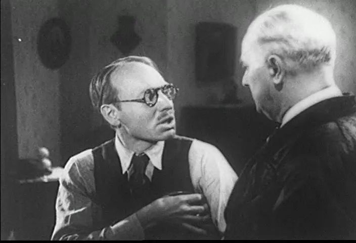 The cashier's confession scene—an emotional exposition for the embezzlement subplot.