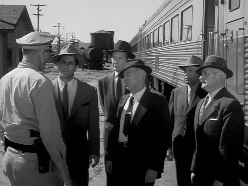 Carney and the Secret Service men establishing rapport with the town's sheriff