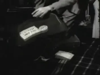 Doctor Brandt discusses the contents of the tin box — the central piece of evidence