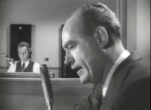 Radio newscast announcing the hitchhiker’s crimes, a recurring motif