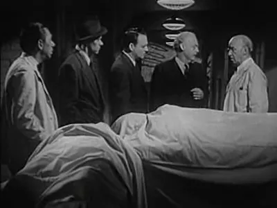 The morgue staff confront the confusion over the substituted corpse