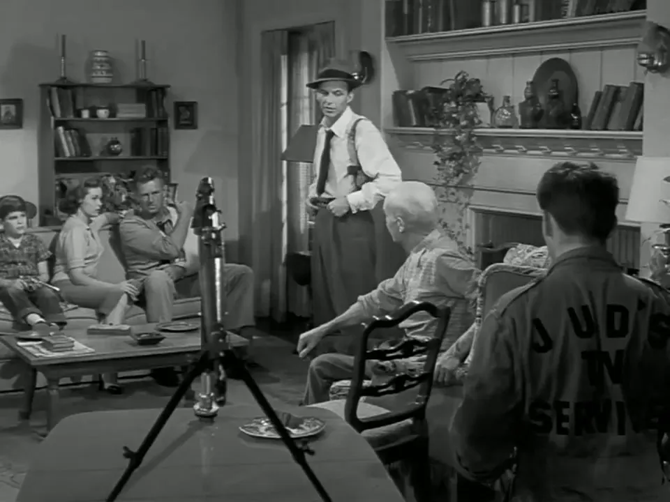 Pop and Jud working on the television connections, a domestic contrivance turned desperate gambit