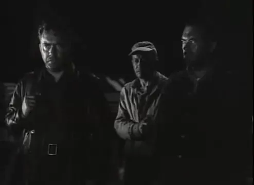 Collins forced to walk along the alley toward the dock, a final perilous movement