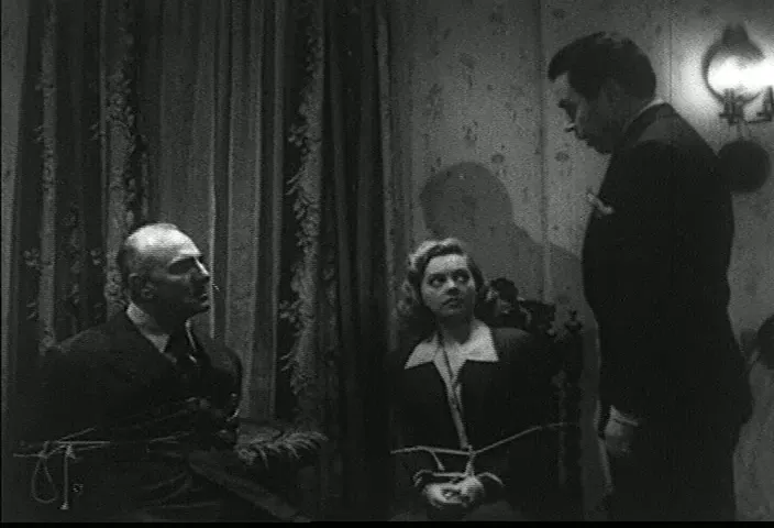 Interrogation sequences emphasize the distribution of suspicion among trapped guests.