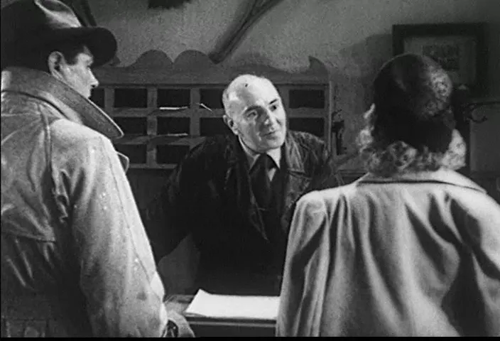 Miss Winfield registers at the motel—her arrival sets several plot threads into motion.