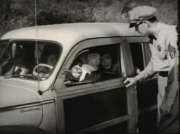 Arrival scene at the Rutherford mansion: a car and the troupe's press agent