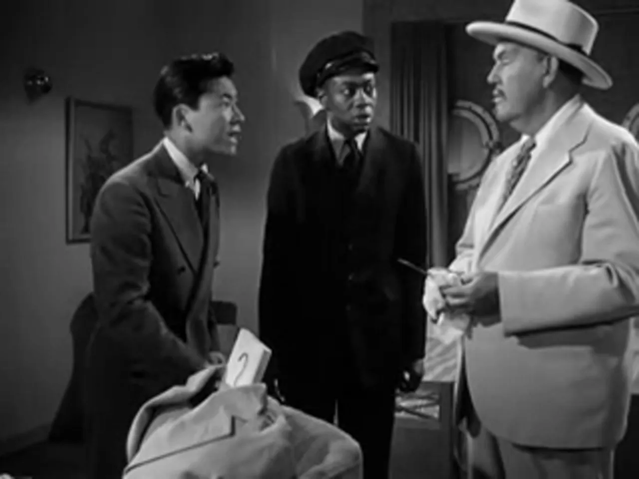 Jimmy Chan and assistants show their fingerprint collection in the cabin