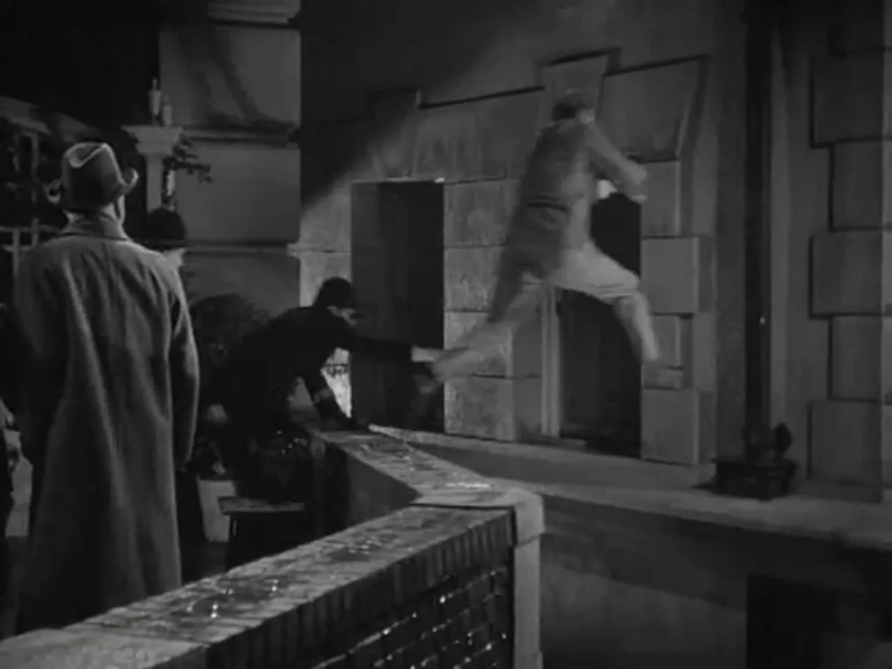 Professor Moriarty making a desperate escape across terraces before his fatal fall