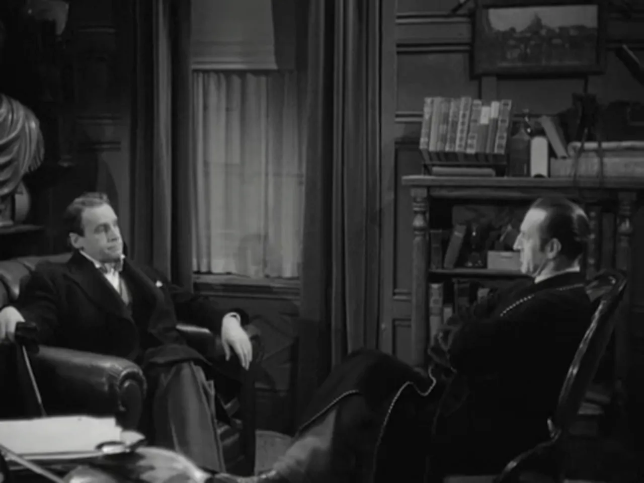 Professor Moriarty (Henry Daniell) confronting Sherlock Holmes in his sitting room