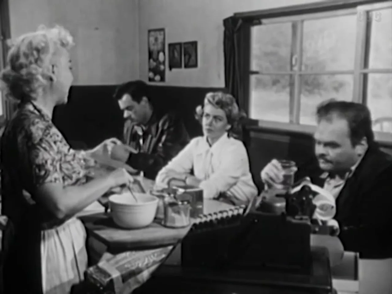 Diner scene: casual conversation conceals suspicion and menace