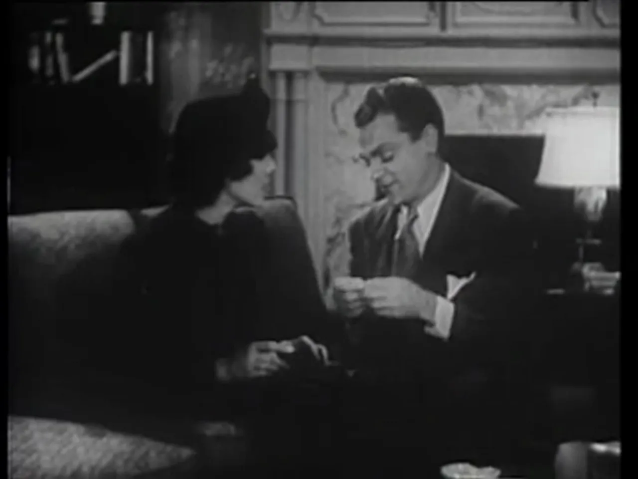 Johnny presents Janet with the wedding ring purchased on the installment plan