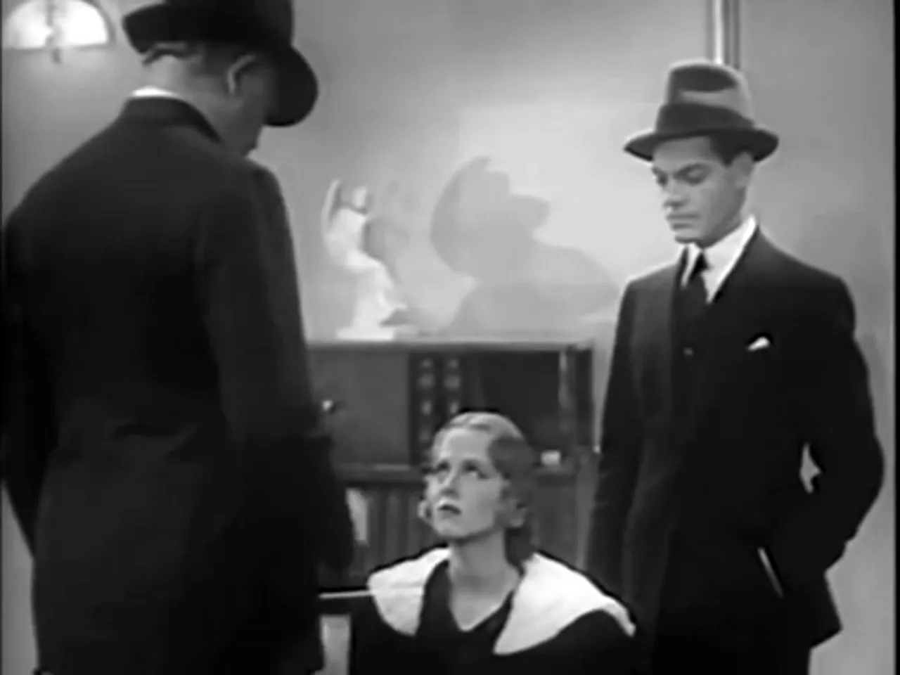 Inspector Queen confronts Miss Temple about her presence in the room