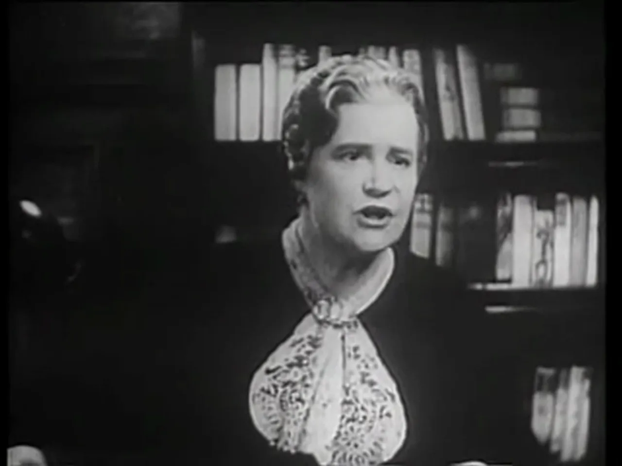 Mrs. Ogilvy reviewing records that uncover half-shipments to the orphanage