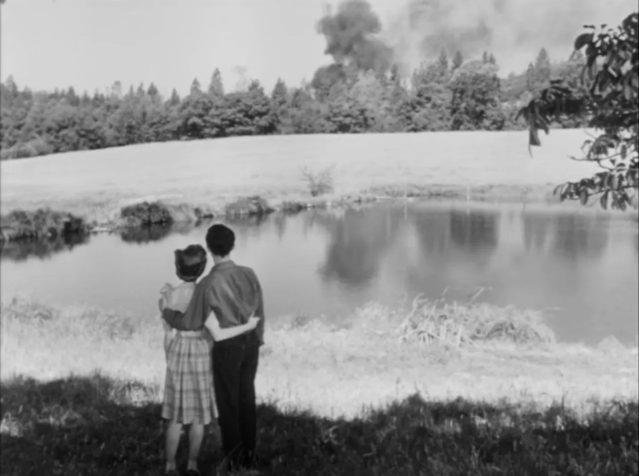 The film’s final scene—fire consumes the red house as characters look on