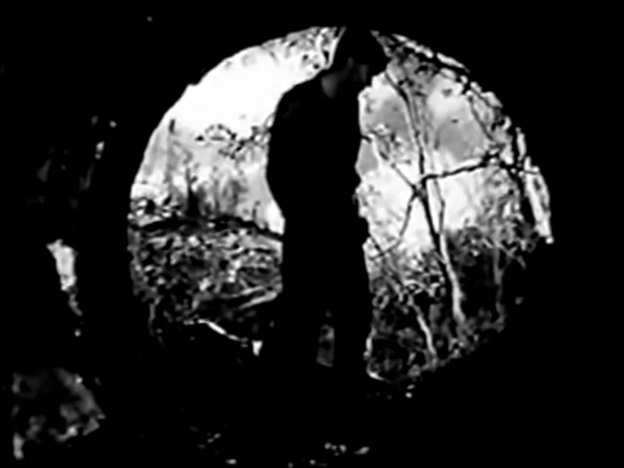 Men crawl from the sewer after a prison break, a classic noir image in the film noir movie