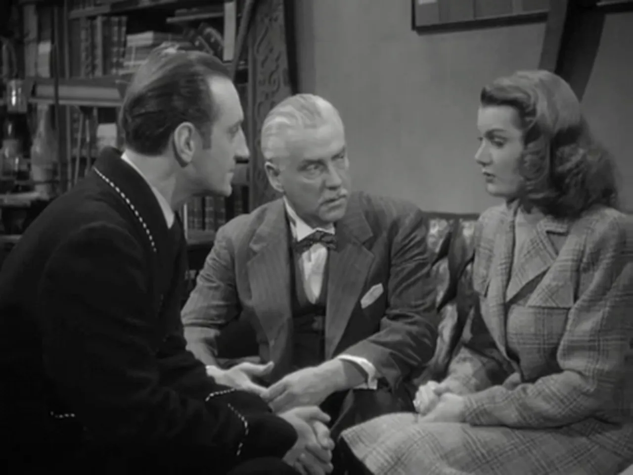 Miss Fenwick confiding in Holmes about her father’s strange nocturnal behavior in the garden