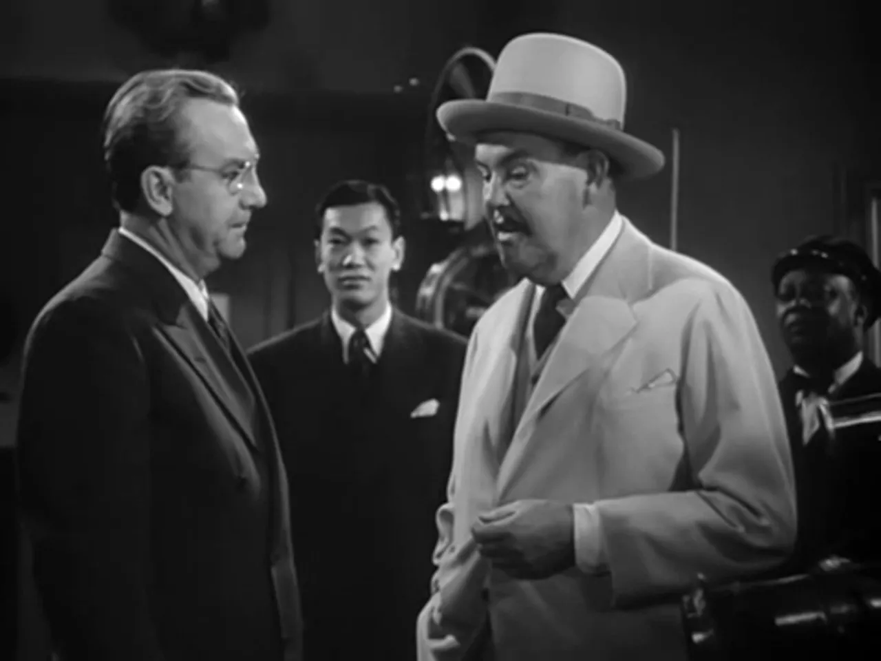 Sidney Toler in the Hamilton laboratory speaking with scientists