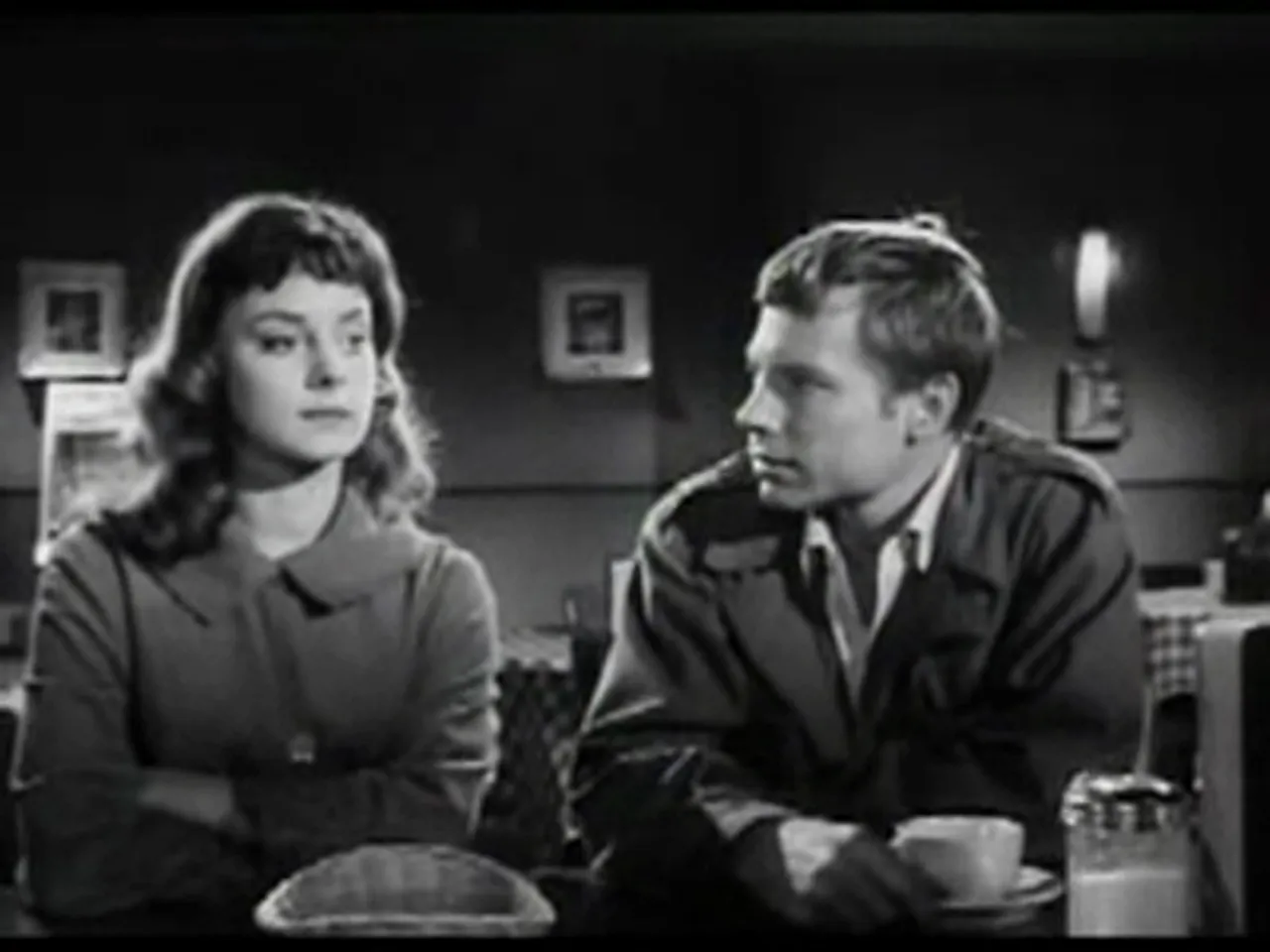 Marv pleading with Betty in a diner — the plan to steal the money is revealed