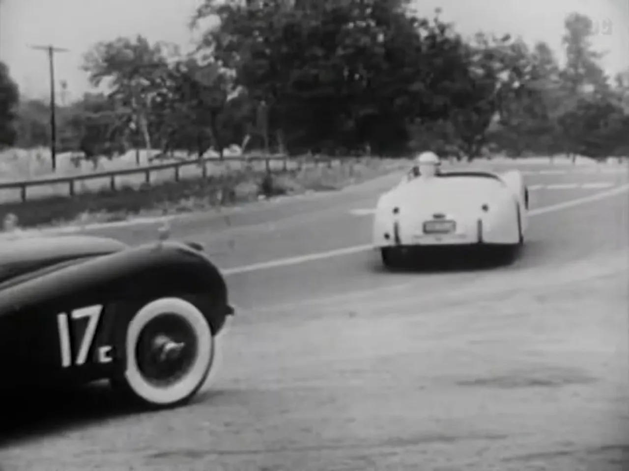 The white Jaguar of the suspect is spotted entering the race