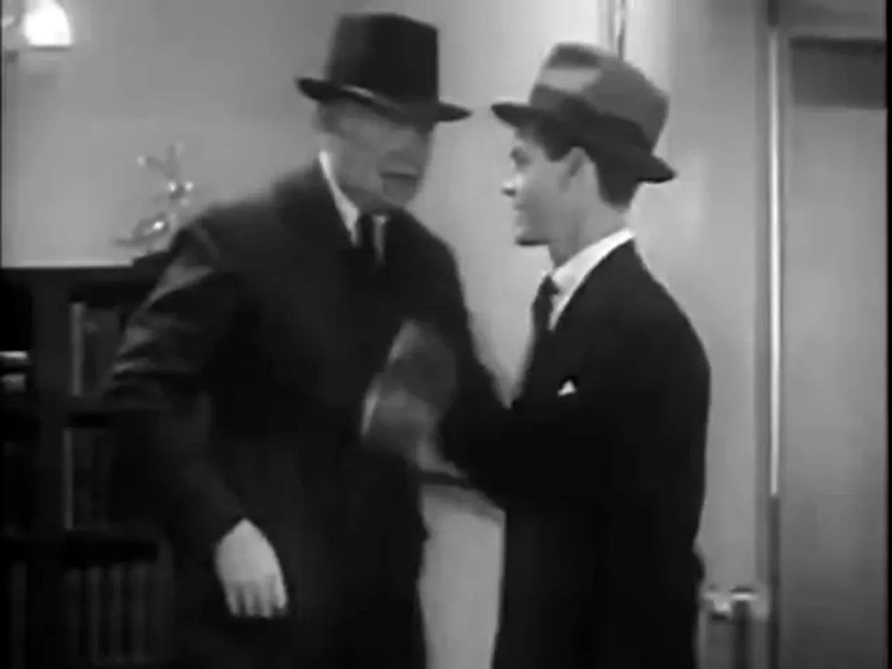Ellery Queen (Eddie Quillan) bursts into the scene with investigative energy
