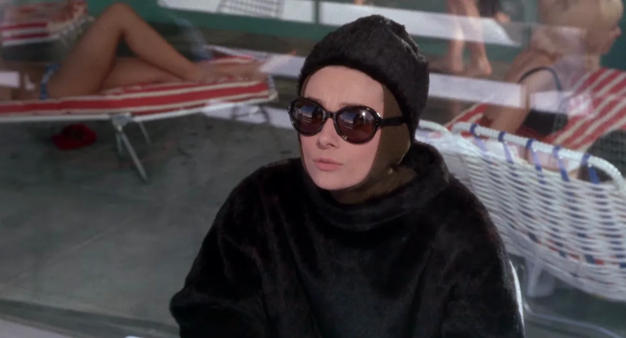 Audrey Hepburn as Regina Lampert on the slopes