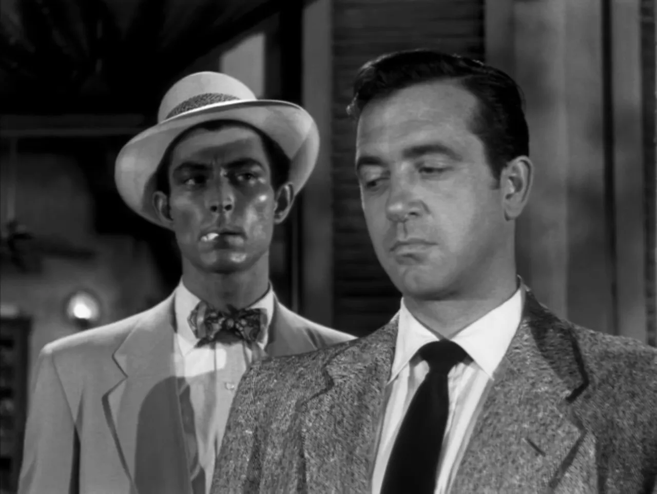 Rolfe displays the torn King card at poker