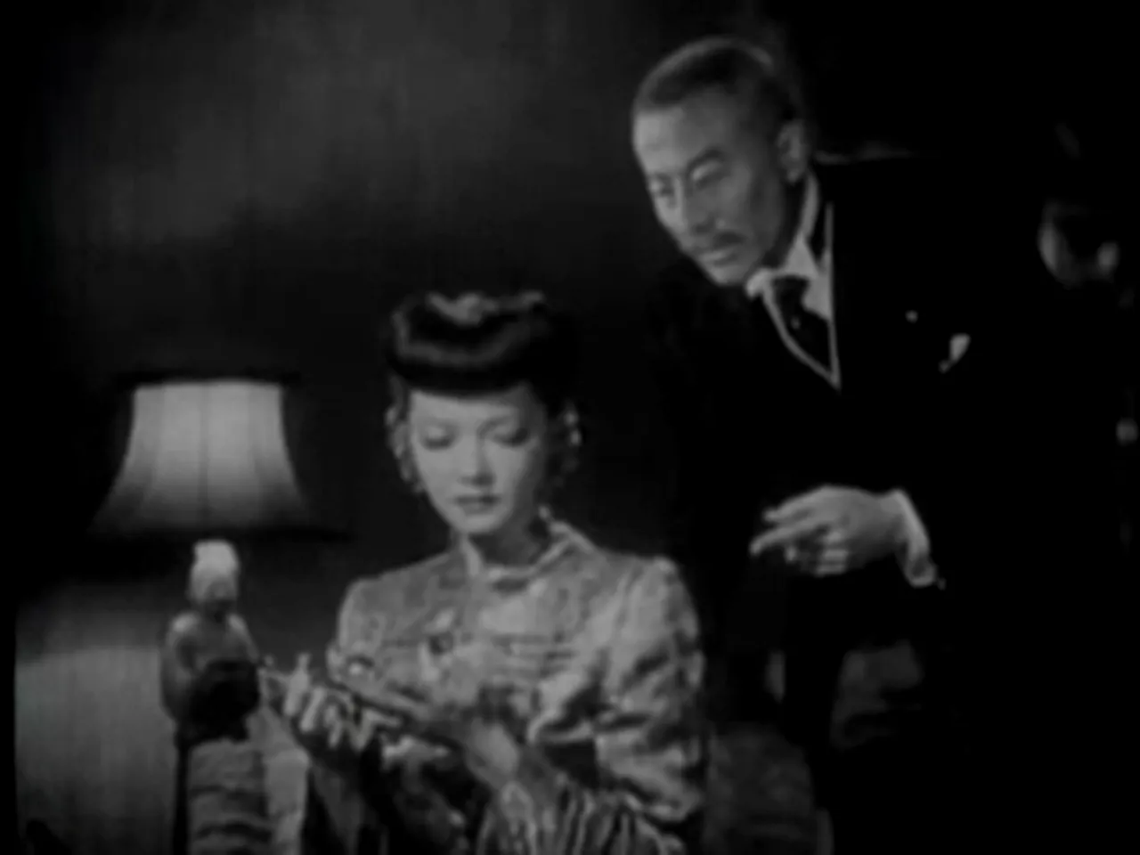 Iris presents a gift and makes an ultimatum