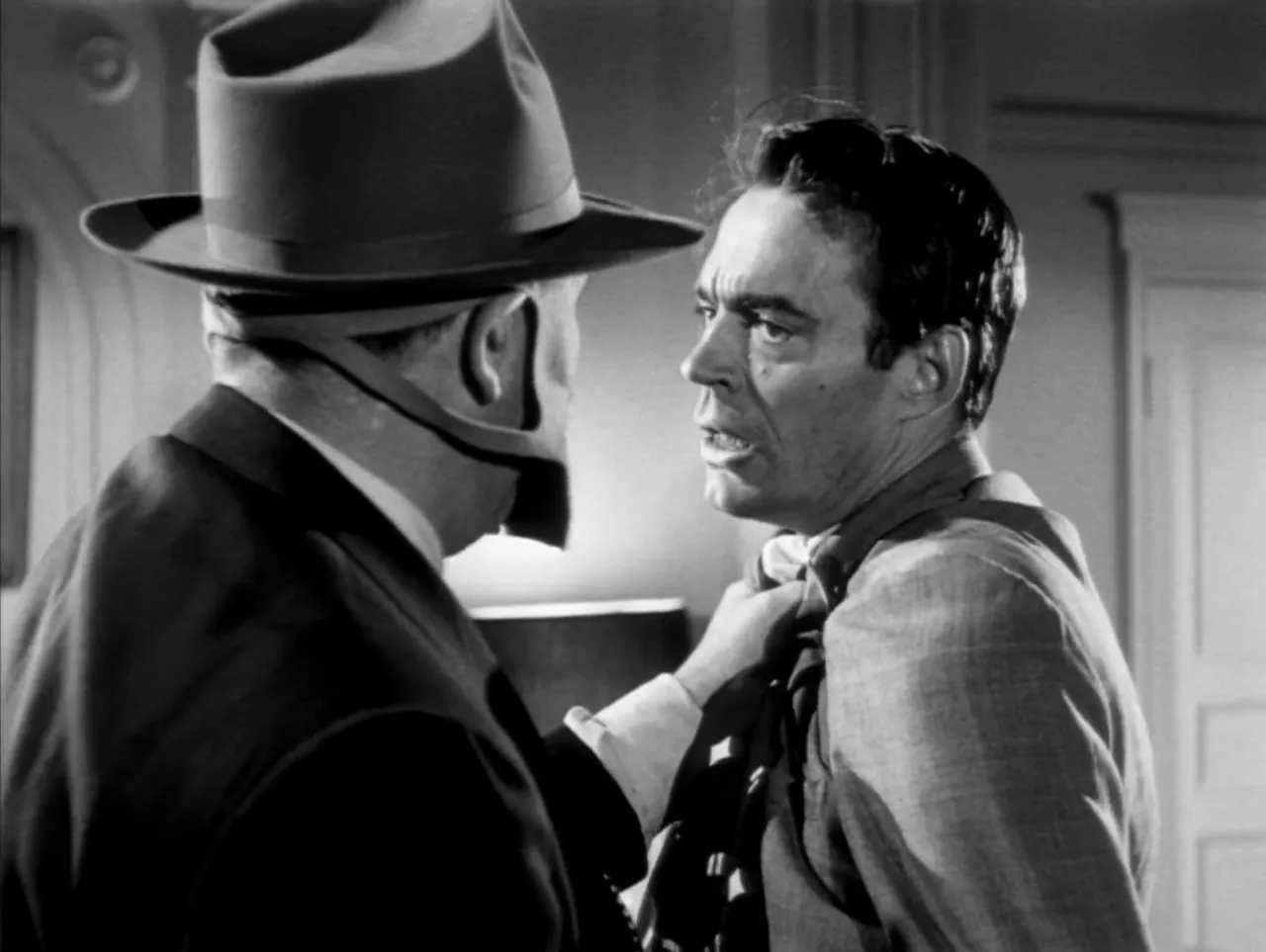 Masked Mr Big threatening a recruit