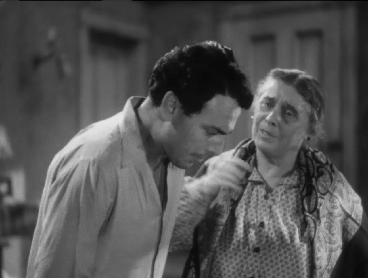 Little Caesar black-and-white scene of a man and woman facing close together with concerned expressions